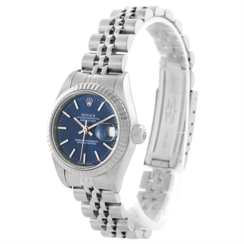 This image shows a Rolex Datejust 79174 Women
s Stainless Steel Blue Dial 79174 Women
s Stainless Steel Blue Dial watch at a three-quarter angle, featuring its blue dial, stainless steel case, and Jubilee bracelet.