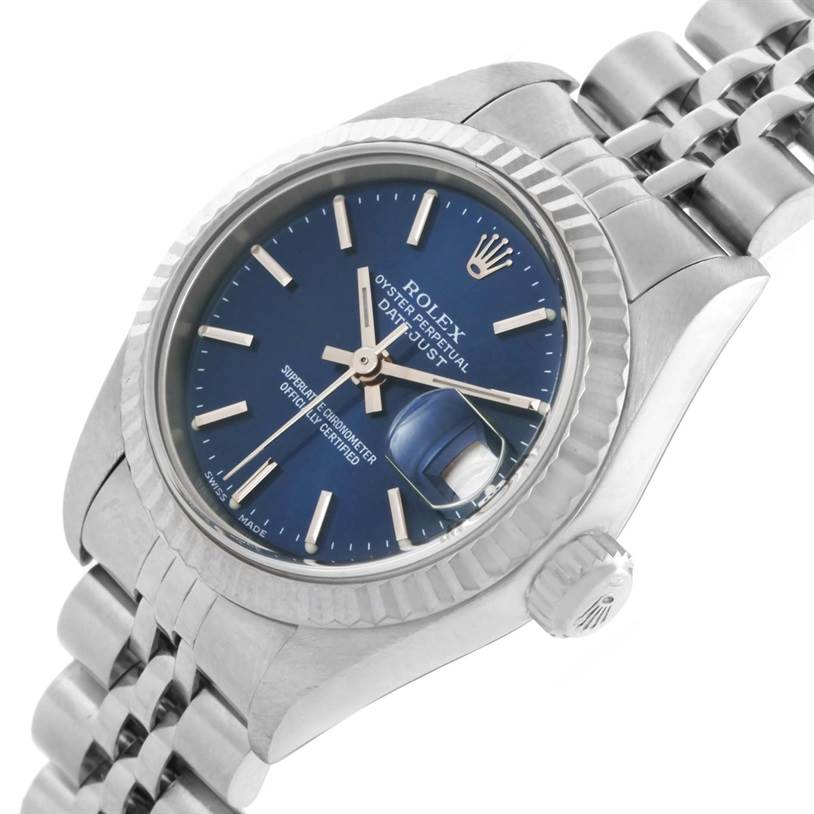 This image shows a Rolex Datejust 79174 Women
s Stainless Steel Blue Dial 79174 Women
s Stainless Steel Blue Dial watch at an angle highlighting the dial, fluted bezel, crown, and part of the bracelet.