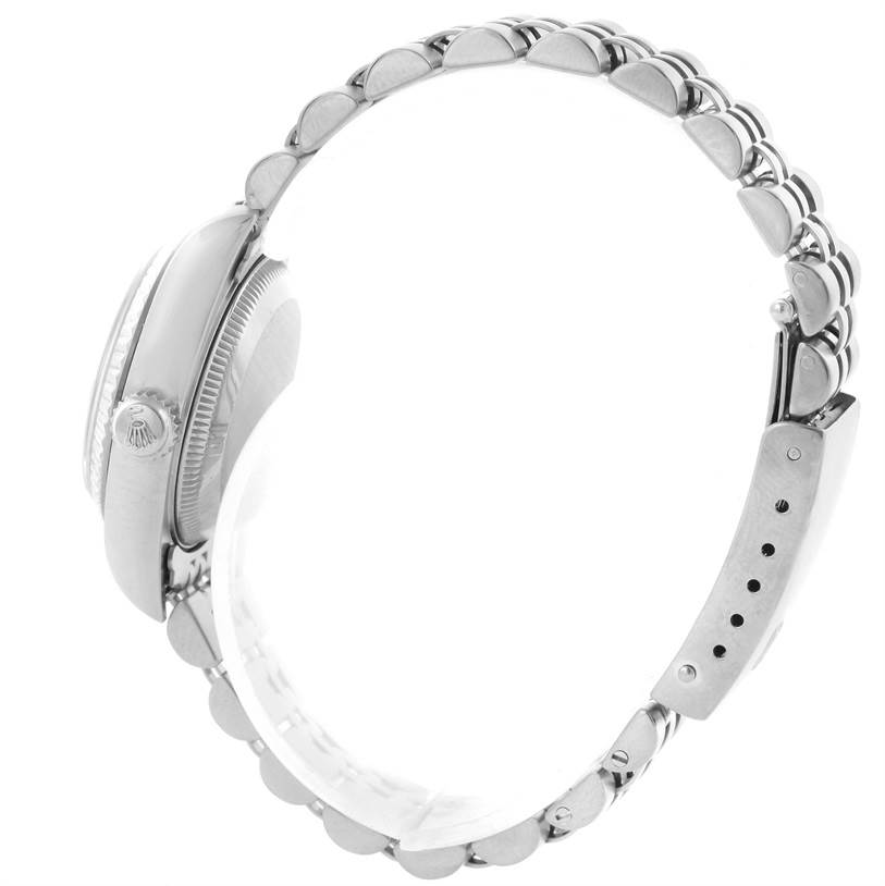 This side view of the Rolex Datejust 79174 Women
s Stainless Steel Blue Dial 79174 Women
s Stainless Steel Blue Dial watch showcases its crown, case profile, and bracelet.