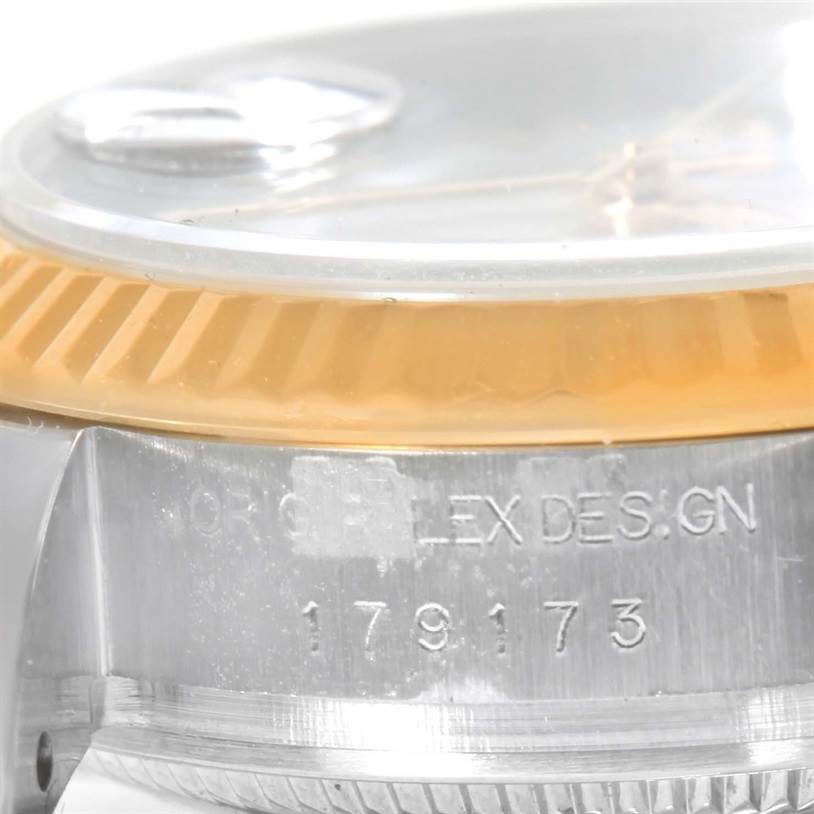 This image shows a close-up of the side view of a Rolex Datejust 179173 Women's Steel and Gold (two tone) White Dial 179173 Women's Steel and Gold (two tone) White Dial watch, focusing on the case and partially visible bezel.
