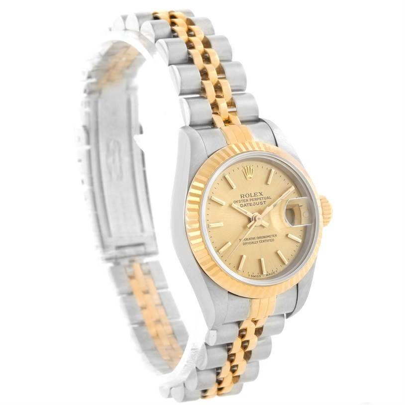 The Rolex Datejust 69173 Women's Stainless Steel Champagne Dial 69173 Women's Stainless Steel Champagne Dial watch is shown at a side angle, displaying its two-tone bracelet and gold bezel.