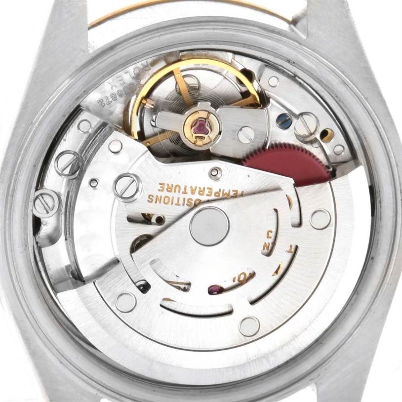 The image shows a close-up view of the movement and inner mechanics of a Rolex Datejust 69173 Women's Stainless Steel Champagne Dial 69173 Women's Stainless Steel Champagne Dial watch.