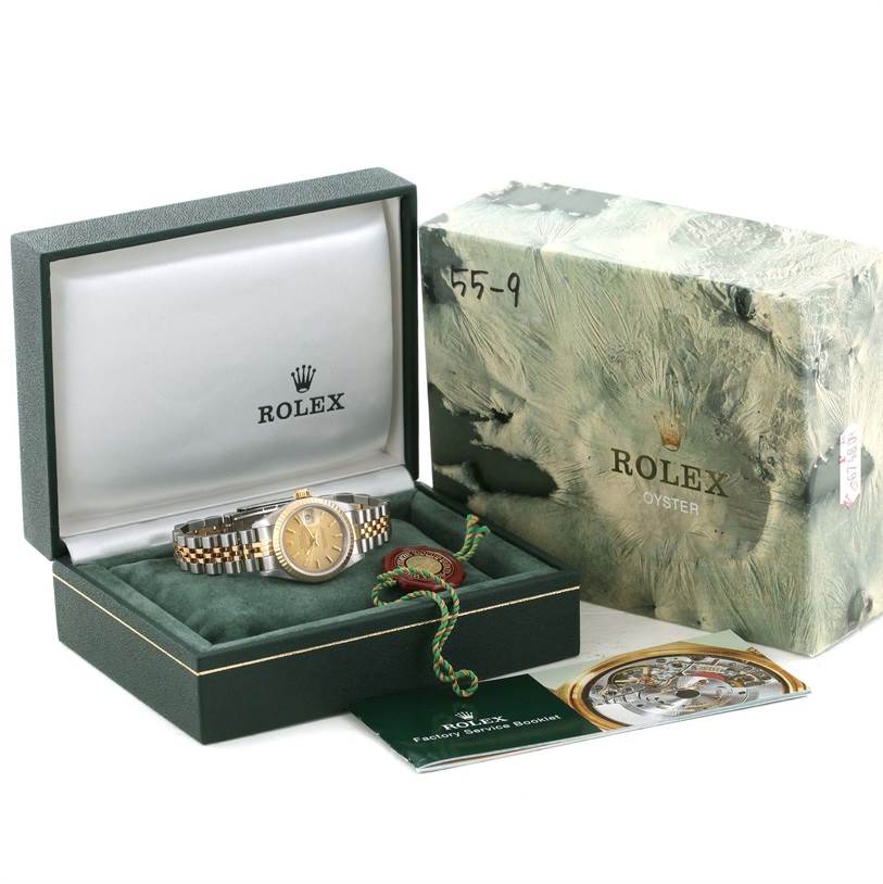 This image shows a Rolex Datejust 69173 Women's Stainless Steel Champagne Dial 69173 Women's Stainless Steel Champagne Dial watch at a front angle, placed inside its open box with accompanying accessories and packaging.