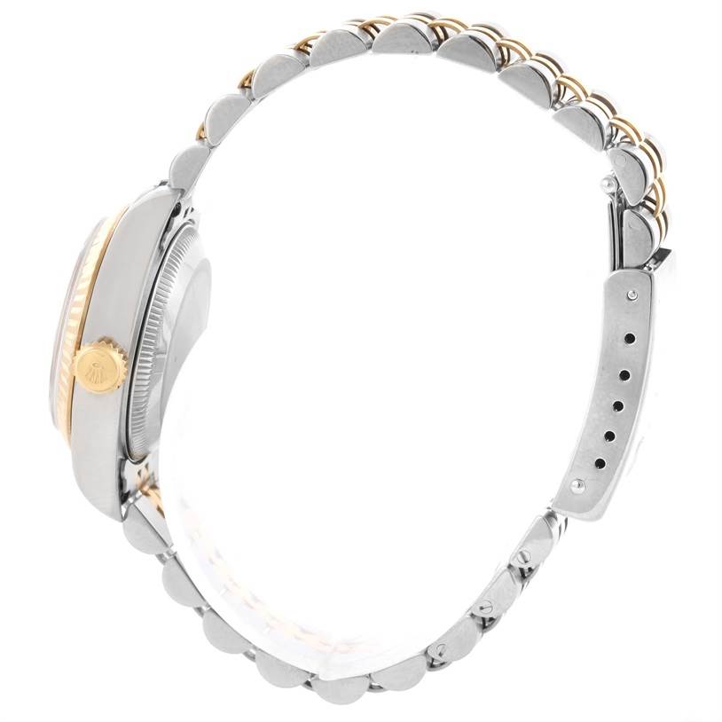 The image shows a side view of a Rolex Datejust 69173 Women's Stainless Steel Champagne Dial 69173 Women's Stainless Steel Champagne Dial watch, highlighting the case, crown, and the Jubilee bracelet.