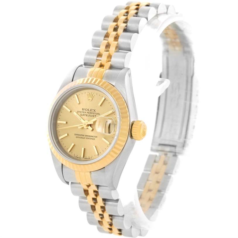 The Rolex Datejust 69173 Women's Stainless Steel Champagne Dial 69173 Women's Stainless Steel Champagne Dial watch is shown at a side angle, featuring the face, bezel, crown, and bi-metal link bracelet.
