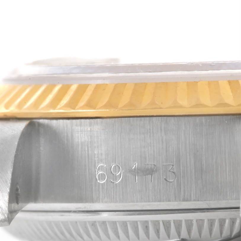 This image shows a close-up side view of the bezel and lug of a Rolex Datejust 69173 Women's Stainless Steel Mother of Pearl Dial 69173 Women's Stainless Steel Mother of Pearl Dial watch with model number 69173 visible.