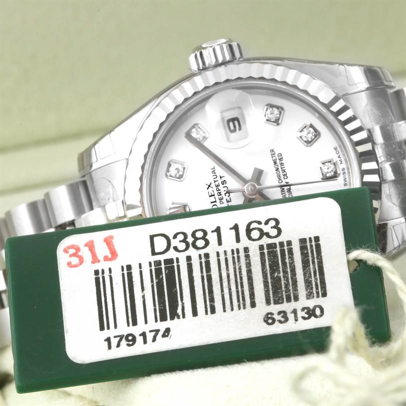 The image shows the face, fluted bezel, and part of the bracelet of a Rolex Datejust 179174 Women's Stainless Steel White Dial 179174 Women's Stainless Steel White Dial watch, along with its barcode tag.