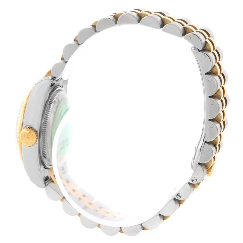 This side view of the Rolex Datejust 179173 Women's Steel and Gold (two tone) White Dial 179173 Women's Steel and Gold (two tone) White Dial watch shows the crown, case, and two-tone bracelet.
