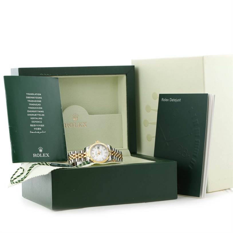 The image shows a Rolex Datejust 179173 Women's Steel and Gold (two tone) White Dial 179173 Women's Steel and Gold (two tone) White Dial watch with its original box and accompanying documentation.