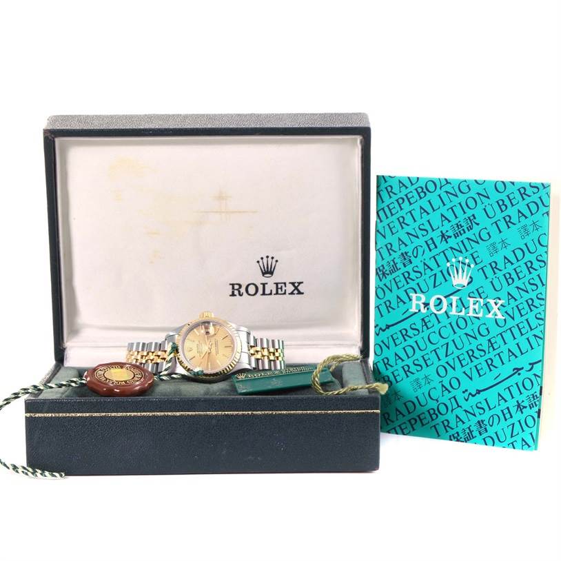The image shows the Rolex Datejust 69173 Women's Stainless Steel Champagne Dial 69173 Women's Stainless Steel Champagne Dial watch and accessories from a front angle inside its original box.