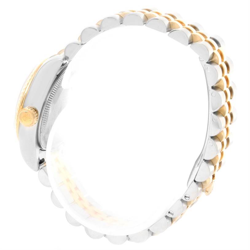 The image shows the side profile and part of the bracelet of a Rolex Datejust 179173 Women's Steel and Gold (two tone) White Dial 179173 Women's Steel and Gold (two tone) White Dial watch.