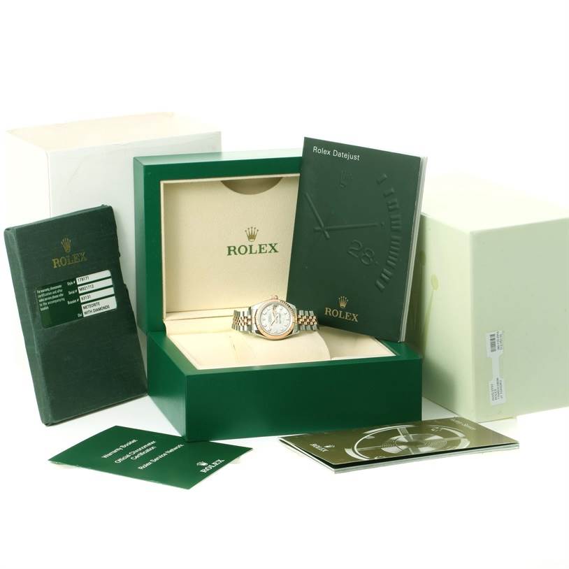 The image shows a Rolex Datejust 179171 Women
s Steel and Gold (two tone) Silver Dial 179171 Women
s Steel and Gold (two tone) Silver Dial watch in its box, with accompanying booklets and documentation displayed around it.