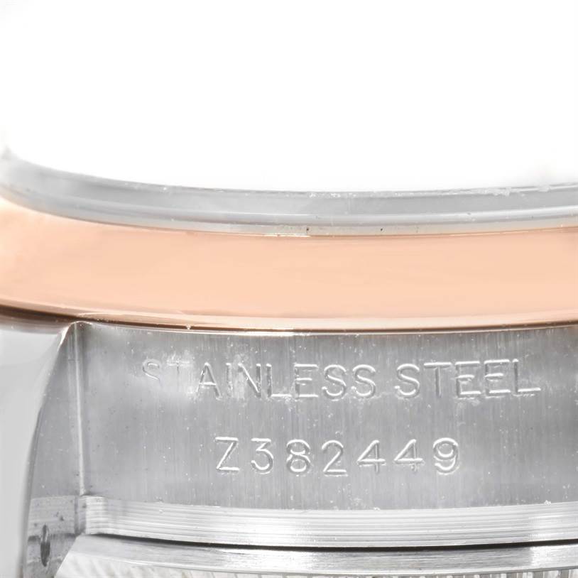 This close-up view of the Rolex Datejust 179161PDO Women's Steel and Gold (two tone) Pink Dial 179161PDO Women's Steel and Gold (two tone) Pink Dial watch shows the stainless steel case back and serial number.