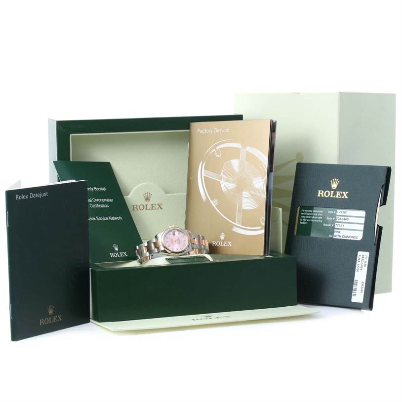 The image shows a Rolex Datejust 179161PDO Women's Steel and Gold (two tone) Pink Dial 179161PDO Women's Steel and Gold (two tone) Pink Dial watch with its box, warranty card holder, and booklets from a front angle.