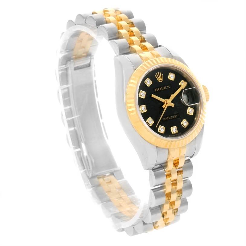 The image shows a side-angle view of a Rolex Datejust 179173 Women's Steel and Gold (two tone) Black Dial 179173 Women's Steel and Gold (two tone) Black Dial watch, highlighting its black dial, diamond hour markers, and two-tone bracelet.