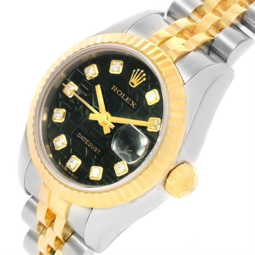 This image shows a close-up side angle of a Rolex Datejust 179173 Women's Steel and Gold (two tone) Black Dial 179173 Women's Steel and Gold (two tone) Black Dial watch, highlighting its bezel, crown, and part of the bracelet.