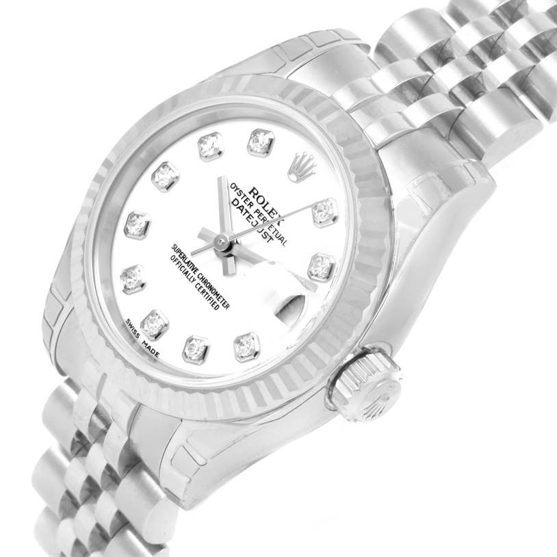 The image shows a close-up, angled view of a Rolex Datejust 179174 Women's Stainless Steel White Dial 179174 Women's Stainless Steel White Dial watch, highlighting its dial, bezel, crown, and part of the bracelet.