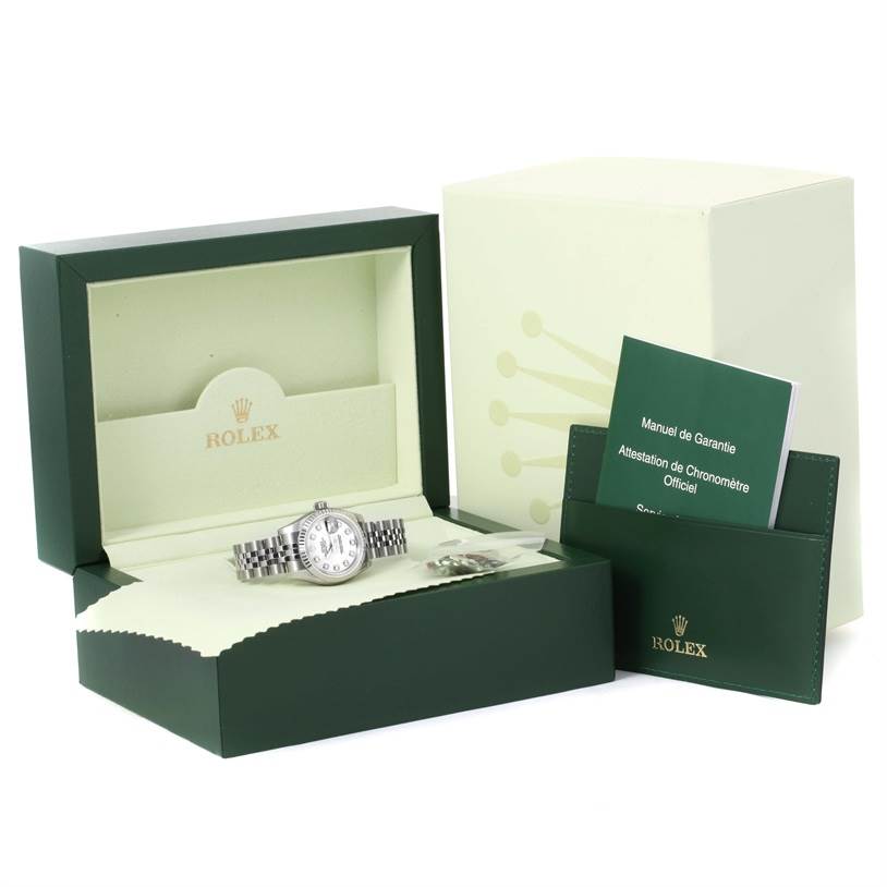 The image shows a Rolex Datejust 179174 Women's Stainless Steel White Dial 179174 Women's Stainless Steel White Dial watch with its box, warranty manual, and accessory pouch, all from a front angle.