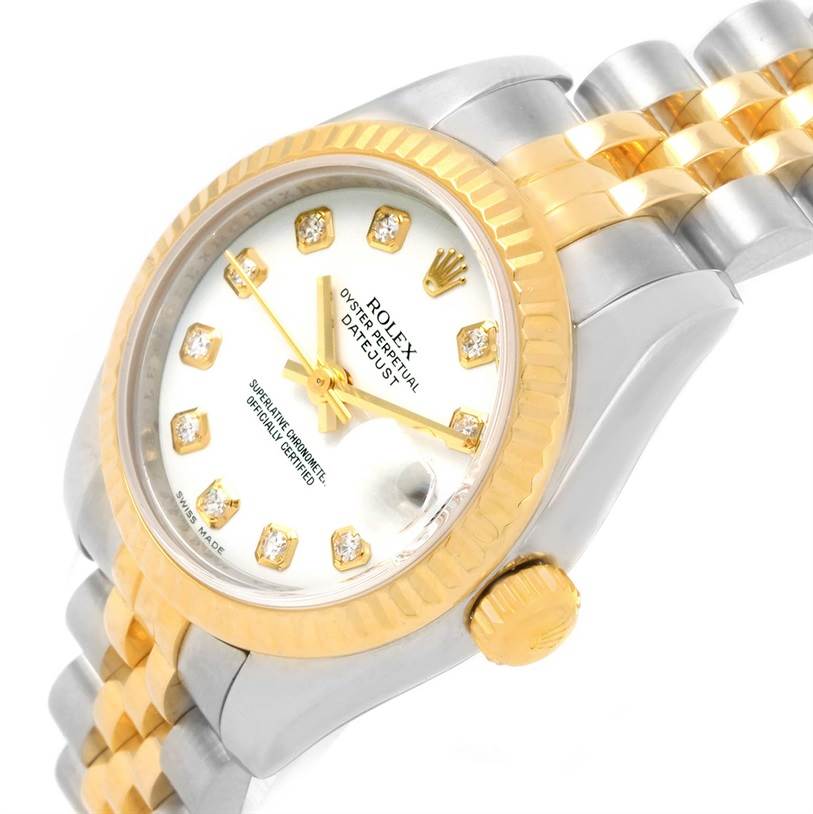 The image shows a Rolex Datejust 179173 Women's Steel and Gold (two tone) Black Dial 179173 Women's Steel and Gold (two tone) Black Dial watch angled to display the face, gold bezel, crown, and part of the bracelet.