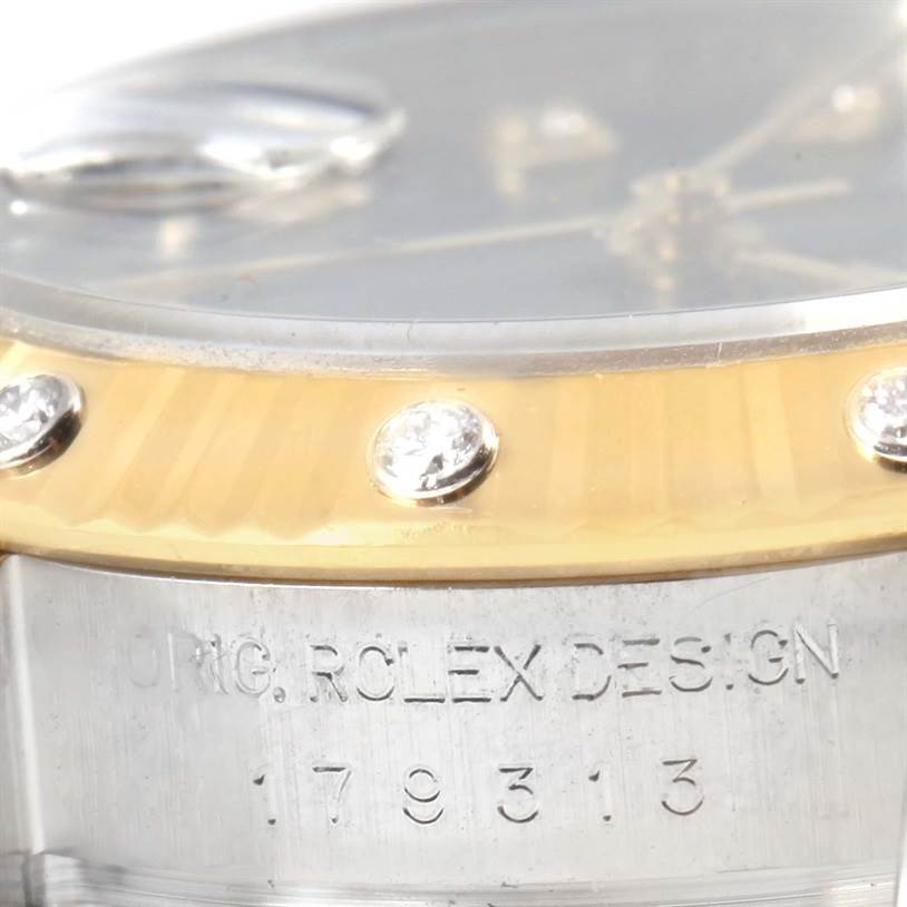 The image shows a close-up of the side engraving and partial bezel of a Rolex Datejust 179313 Women
s Stainless Steel Champagne Dial 179313 Women
s Stainless Steel Champagne Dial watch.