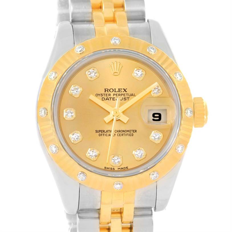 This image shows a front view of the Rolex Datejust 179313 Women
s Stainless Steel Champagne Dial 179313 Women
s Stainless Steel Champagne Dial watch, highlighting its gold dial, diamond hour markers, gold bezel, and date window.