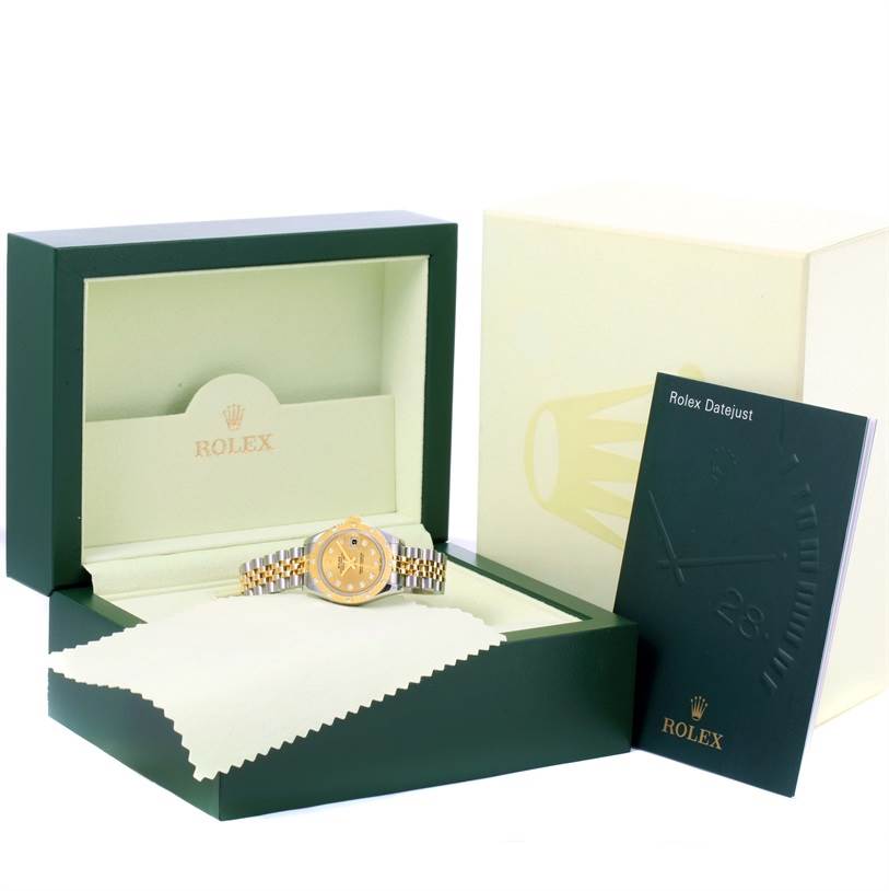 The image shows a Rolex Datejust 179313 Women
s Stainless Steel Champagne Dial 179313 Women
s Stainless Steel Champagne Dial watch in its open box, accompanied by a booklet and cleaning cloth.