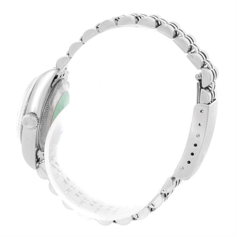 The image shows a side view of a Rolex Datejust 79174 Women's Stainless Steel Pink Dial 79174 Women's Stainless Steel Pink Dial watch, highlighting its bracelet, crown, and case.