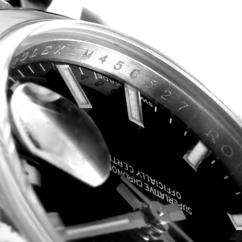 The image shows a close-up angle of the Rolex Datejust 179160 Women
s Stainless Steel Black Dial 179160 Women
s Stainless Steel Black Dial dial, focusing on the markers, hands, and the inner bezel.