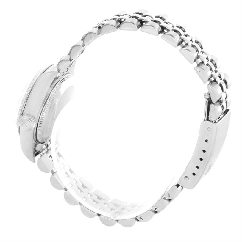 The image shows a side view of the Rolex Datejust 79174 Women
s Stainless Steel Silver Dial 79174 Women
s Stainless Steel Silver Dial watch, highlighting the case, crown, and bracelet.