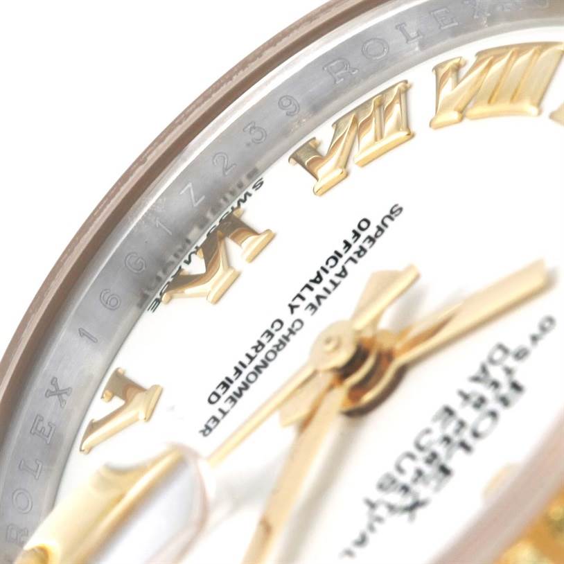 The image shows a close-up of the dial, hands, and Roman numeral markers of a Rolex Datejust 179173 Women's Steel and Gold (two tone) White Dial 179173 Women's Steel and Gold (two tone) White Dial watch.