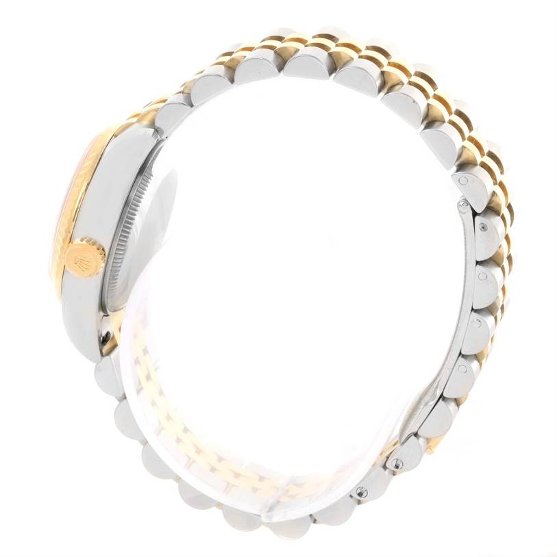 This image shows a side profile of a Rolex Datejust 179173 Women's Steel and Gold (two tone) White Dial 179173 Women's Steel and Gold (two tone) White Dial watch, highlighting the crown and the two-tone bracelet.