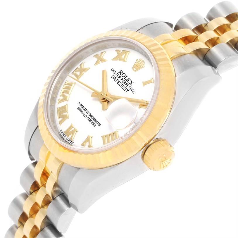 The image shows a Rolex Datejust 179173 Women's Steel and Gold (two tone) White Dial 179173 Women's Steel and Gold (two tone) White Dial watch's dial, bezel, crown, and part of its two-tone bracelet at a side angle.