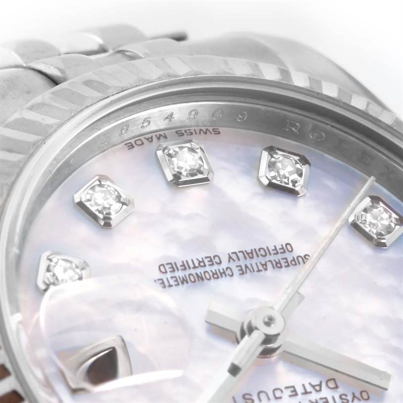 This image shows a close-up of the face, dial, bezel, and bracelet of a Rolex Datejust 179174 Women
s Stainless Steel Mother of Pearl Dial 179174 Women
s Stainless Steel Mother of Pearl Dial watch, focusing on the diamond hour markers.