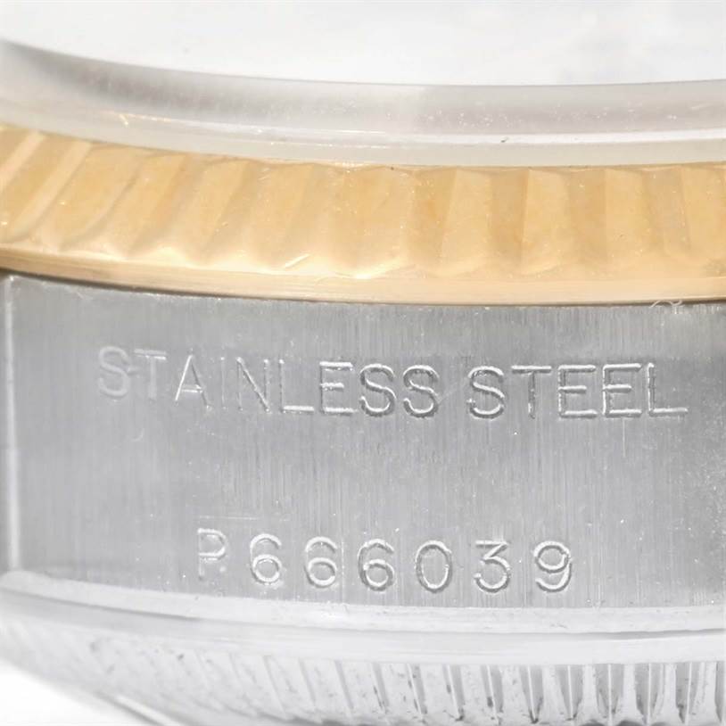 This image shows a close-up of the stainless steel casing and edge of the bezel of a Rolex Datejust 79173 Women
s Stainless Steel White Dial 79173 Women
s Stainless Steel White Dial watch.