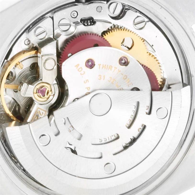 This image shows a close-up view of the mechanical movement of a Rolex Datejust 179174 Women's Stainless Steel Black Dial 179174 Women's Stainless Steel Black Dial watch, highlighting gears and internal components.