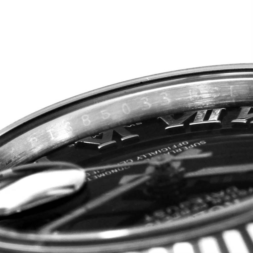 The image shows a close-up of the dial and rehaut (inner bezel) with etched serial number of a Rolex Datejust 179174 Women's Stainless Steel Black Dial 179174 Women's Stainless Steel Black Dial watch.