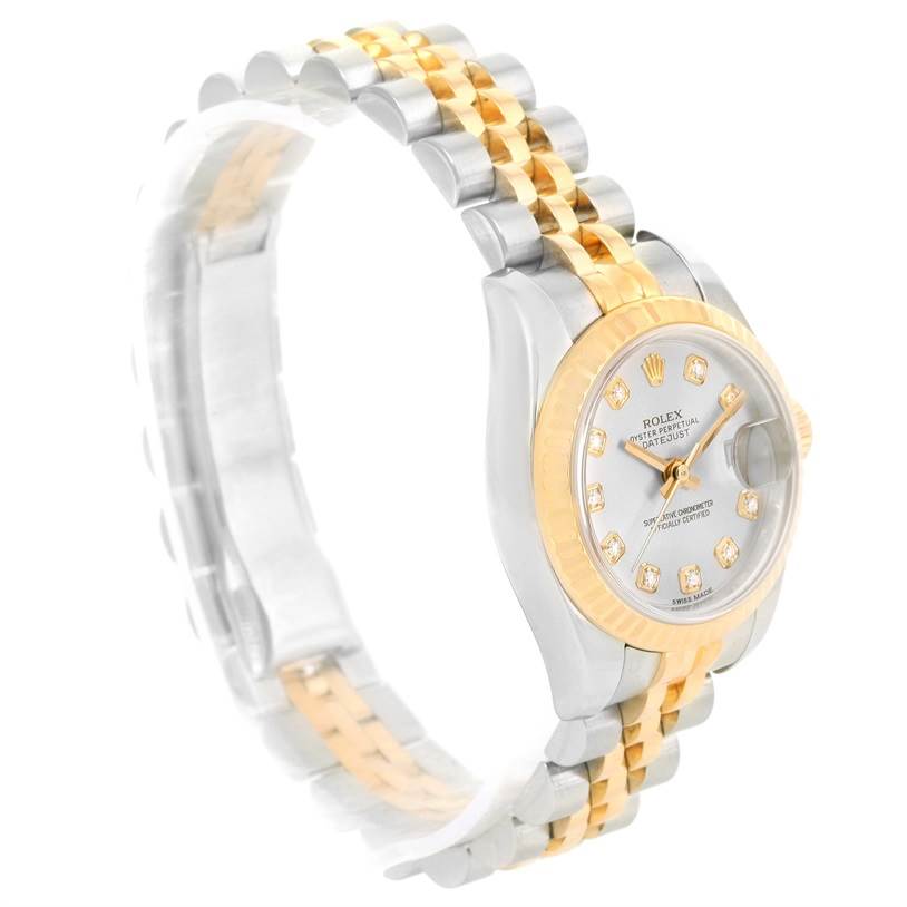 The Rolex Datejust 179173 Women's Steel and Gold (two tone) Silver Dial 179173 Women's Steel and Gold (two tone) Silver Dial watch is shown at a three-quarter angle, highlighting its gold and silver bracelet and diamond-accented dial.