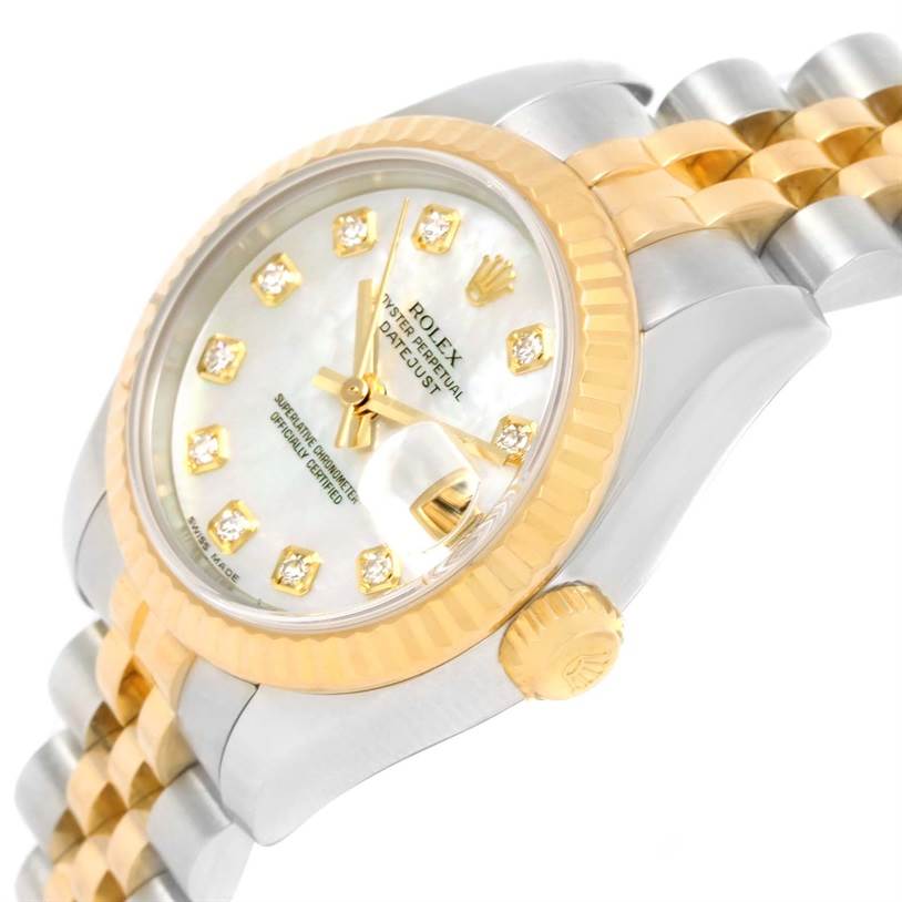 The image shows a close-up angle of a Rolex Datejust 179173 Women's Steel and Gold (two tone) Mother of Pearl Dial 179173 Women's Steel and Gold (two tone) Mother of Pearl Dial model, highlighting its dial, fluted bezel, crown, and two-tone bracelet.
