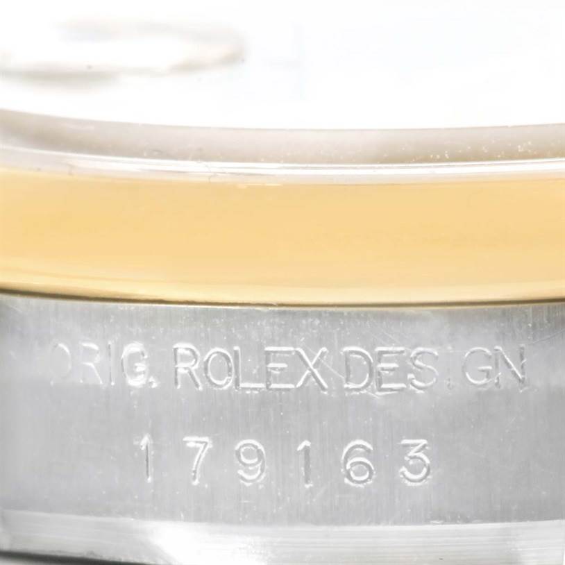 The image shows a close-up of the case edge and reference number of a Rolex Datejust 179163 Women's Steel and Gold (two tone) Champagne Dial 179163 Women's Steel and Gold (two tone) Champagne Dial watch, specifically model 179163.