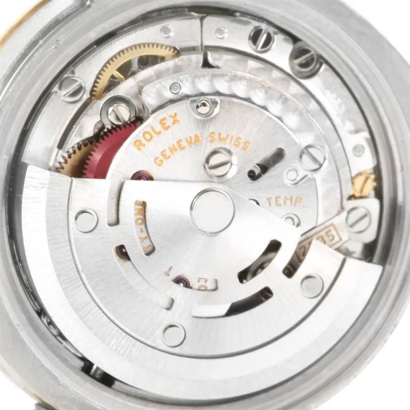 The image shows a close-up view of the Rolex Datejust 179163 Women's Steel and Gold (two tone) Champagne Dial 179163 Women's Steel and Gold (two tone) Champagne Dial movement with visible gears, rotor, and mechanisms.