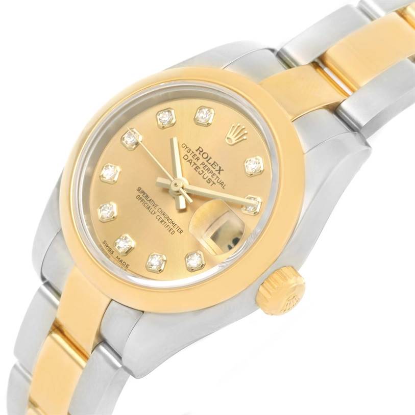 The Rolex Datejust 179163 Women's Steel and Gold (two tone) Champagne Dial 179163 Women's Steel and Gold (two tone) Champagne Dial watch is shown at an angled close-up, featuring its dial, crown, and part of the bracelet.