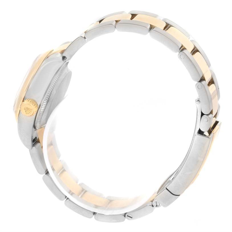 The image shows a side view of a Rolex Datejust 179163 Women's Steel and Gold (two tone) Champagne Dial 179163 Women's Steel and Gold (two tone) Champagne Dial watch, highlighting the crown, case, and bracelet links. 