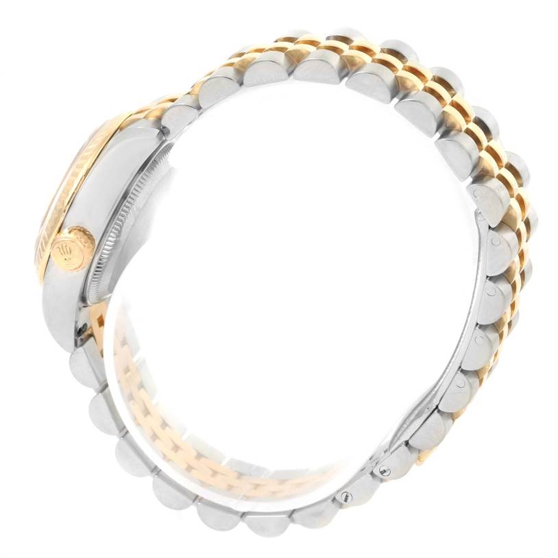 This image shows a side view of a Rolex Datejust 179173 Women's Steel and Gold (two tone) Mother of Pearl Dial 179173 Women's Steel and Gold (two tone) Mother of Pearl Dial watch, highlighting its two-tone bracelet and crown.