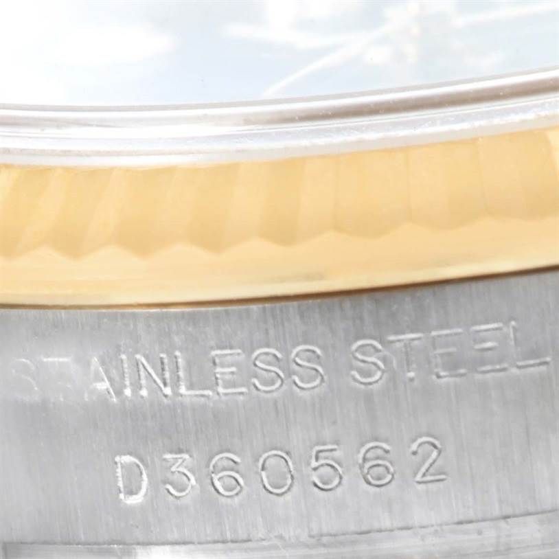This close-up image shows the bezel, dial, and stainless steel case with the inscription of the Rolex Datejust 179173 Women's Steel and Gold (two tone) Blue Dial 179173 Women's Steel and Gold (two tone) Blue Dial model.