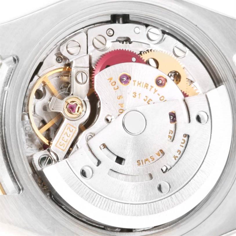 This image showcases the internal mechanical movement of a Rolex Datejust 179173 Women's Steel and Gold (two tone) Blue Dial 179173 Women's Steel and Gold (two tone) Blue Dial watch from a close-up angle.