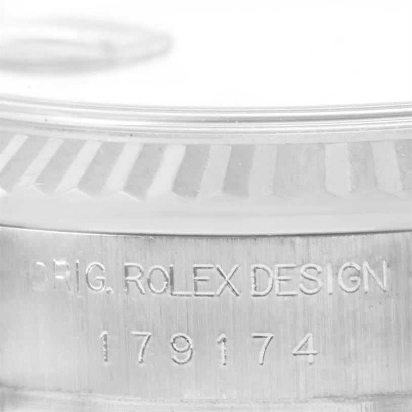 This is a close-up of the bezel and the engraved model number on the case of a Rolex Datejust 179174 Women
s Stainless Steel Black Dial 179174 Women
s Stainless Steel Black Dial watch.