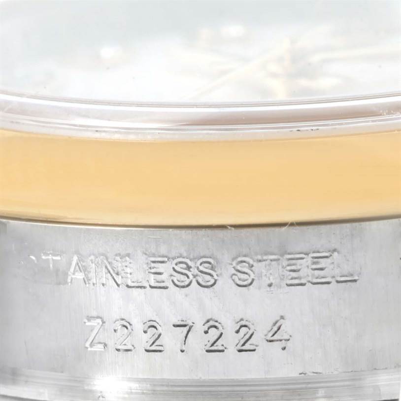 This image shows a close-up of the side and serial number of a Rolex Datejust 179163 Women's Steel and Gold (two tone) Silver Dial 179163 Women's Steel and Gold (two tone) Silver Dial watch.