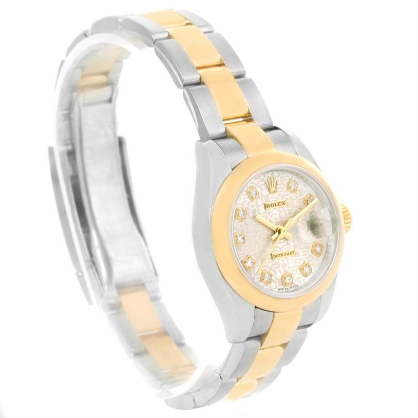 The Rolex Datejust 179163 Women's Steel and Gold (two tone) Silver Dial 179163 Women's Steel and Gold (two tone) Silver Dial watch is shown from a side angle, highlighting its gold and silver band, and diamond-studded dial.