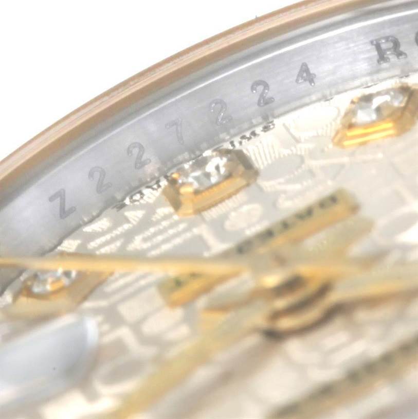 The image shows a close-up angled view of the dial and edge of the Rolex Datejust 179163 Women's Steel and Gold (two tone) Silver Dial 179163 Women's Steel and Gold (two tone) Silver Dial watch, highlighting the serial number and part of the hour markers.