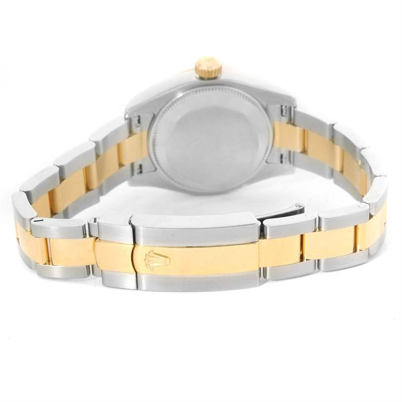 The image shows the back view of a Rolex Datejust 179173 Women's Steel and Gold (two tone) Silver Dial 179173 Women's Steel and Gold (two tone) Silver Dial watch, highlighting the case back and two-tone bracelet with the Rolex crown logo on the clasp.